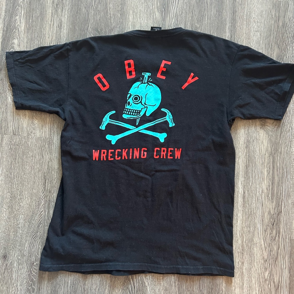 OBEY WRECKING CREW GRAPHIC SKULL men’s t-shirt in black, blue, red
Size Medium